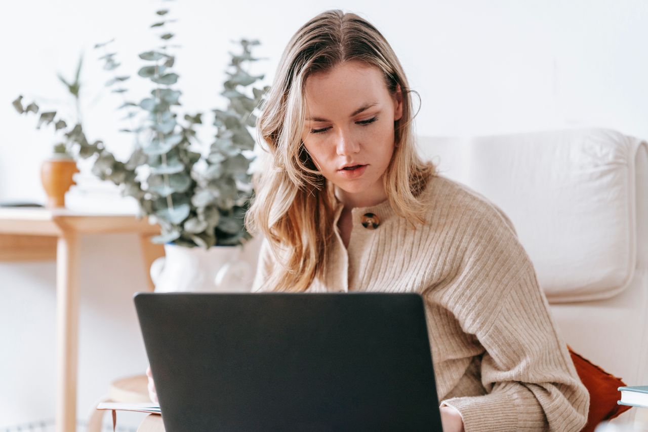 Business owner reviewing information on a laptop